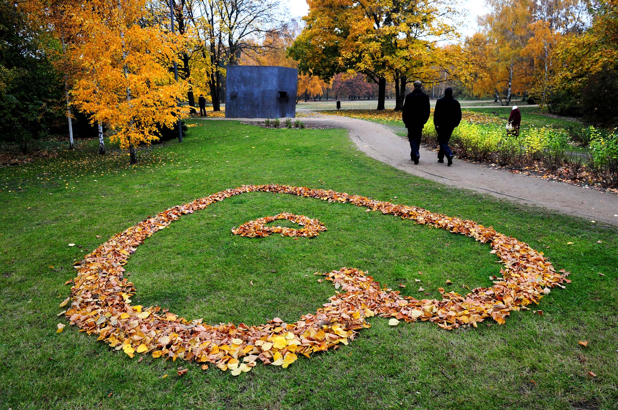 NOVEMBER 2: People walk past a heart made of autumnally colored leaves in Berlin