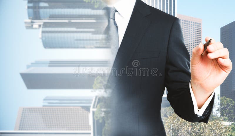 Businessman drawing in city. Abstract blurry businessman drawing on city background with copy space. Success concept. Double exposure royalty free stock photo
