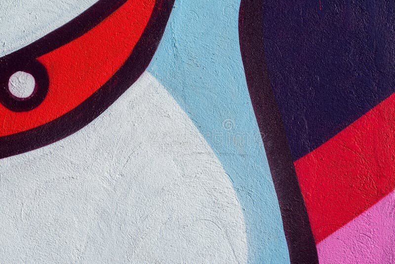 Beautiful fragment of wall with detail of graffiti, street art. Abstract creative drawing fashion colors on the city. Walls. Modern iconic urban culture. For stock photo Beautiful fragment of wall with detail of graffiti, street art. Abstract creative drawing fashion colors on the city. Walls. Modern iconic urban culture. For stock photo
