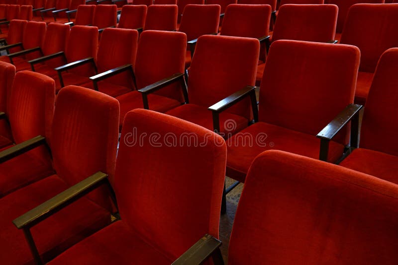 Rows of red soft chair seats close up. Close up red soft chair seats in a row, personal perspective, high angle view stock photos Rows of red soft chair seats close up. Close up red soft chair seats in a row, personal perspective, high angle view stock photos