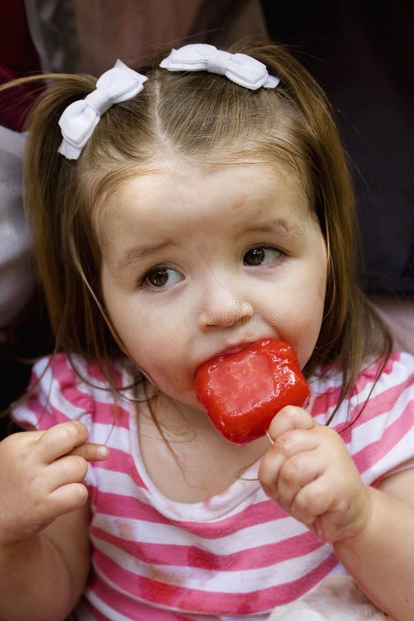 Cute little Girl eating Ice Cream stock photo