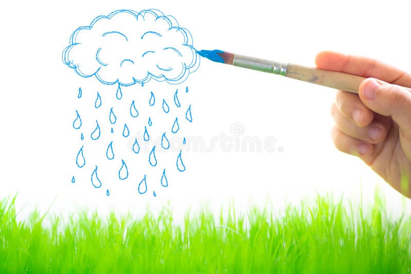 Drawing clouds and rain. Over spring green grass royalty free stock photography Drawing clouds and rain. Over spring green grass royalty free stock photography