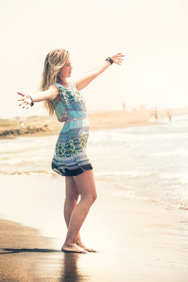 Embrace the sea, dream beach woman. Peace and freedom stock images