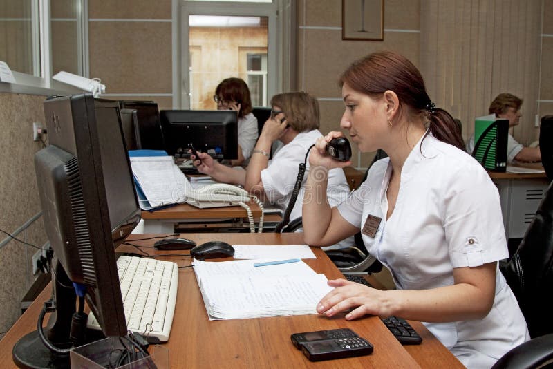 Emergency Rescue Service dispatcher at work. Emergency dispatcher in the control room Emergency Rescue Service Manager at work stock photo Emergency Rescue Service dispatcher at work. Emergency dispatcher in the control room Emergency Rescue Service Manager at work stock photo