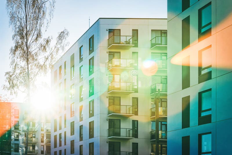 Facade apartment house copy space green tree sun light. Facade of a modern residential apartment house building. Including place for copy space. And green tree royalty free stock images Facade apartment house copy space green tree sun light. Facade of a modern residential apartment house building. Including place for copy space. And green tree royalty free stock images