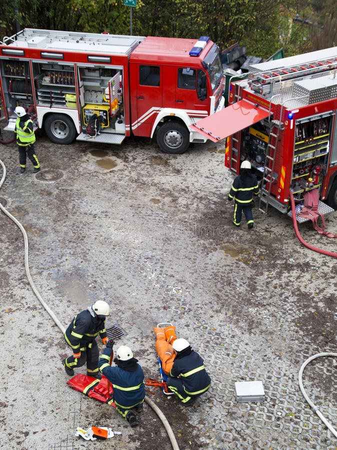 Fire departments and emergency response teams on drill. Ljubljana, Slovenia, 10.11.2013, Fire departments and emergency response teams will conduct disaster stock photos Fire departments and emergency response teams on drill. Ljubljana, Slovenia, 10.11.2013, Fire departments and emergency response teams will conduct disaster stock photos