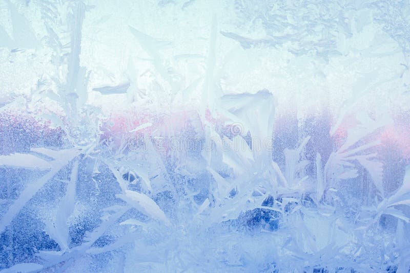 Frost drawing on window glass, snowflake ornament after anomaly ice cold.  royalty free stock image