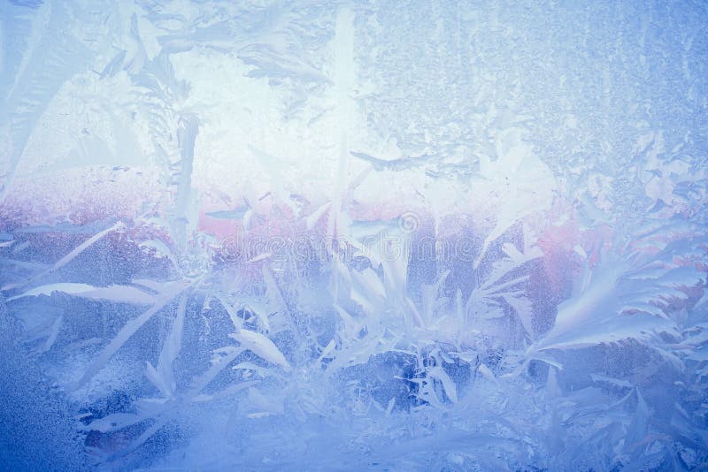 Frost drawing on window glass, snowflake ornament after anomaly ice cold.  royalty free stock photo