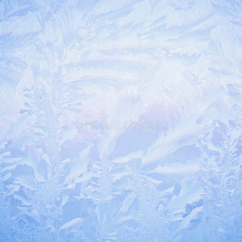 Frost drawing on window glass, snowflake ornament after anomaly ice cold.  stock photography