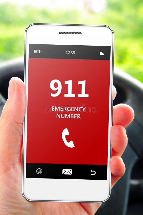 Hand holding mobile phone 911 emergency number in car. Focus on phone royalty free stock image Hand holding mobile phone 911 emergency number in car. Focus on phone royalty free stock image