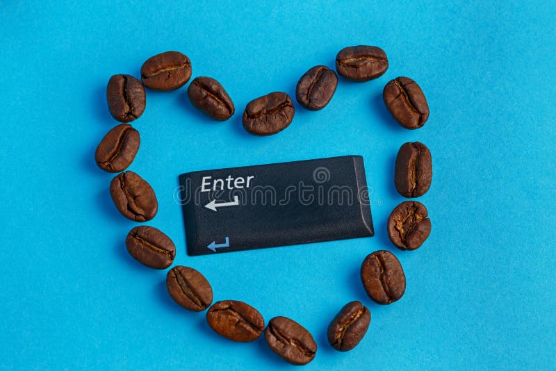 Heart shaped coffee beans on a blue background in the center enter button. Heart shaped coffee beans on blue background in the center enter button stock image