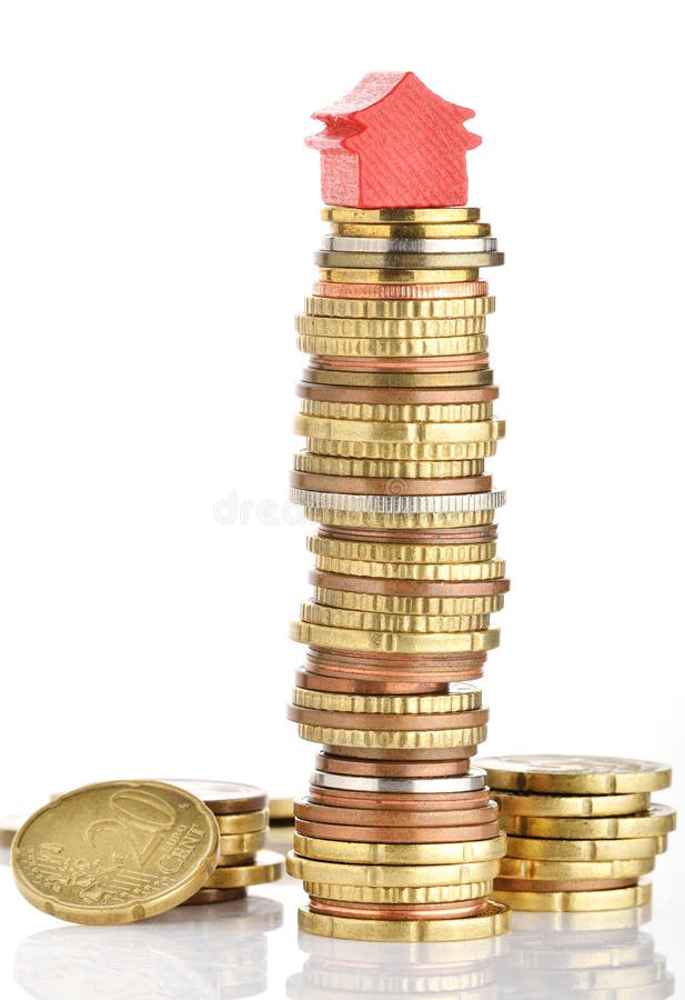 House prices. Model house on a stack of coins representing high prices on real estate market stock image House prices. Model house on a stack of coins representing high prices on real estate market stock image