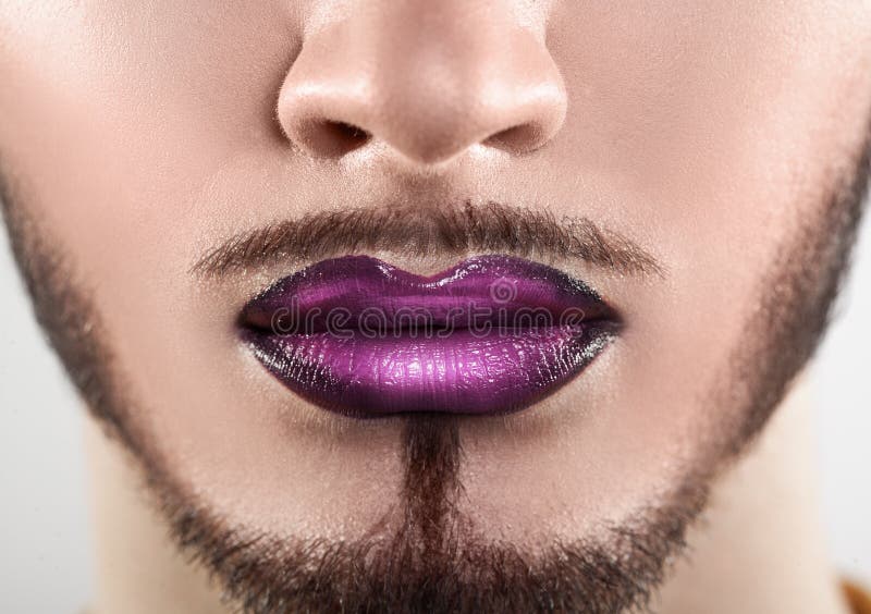 Macro photo of bearded male lips with makeup. Horizontal. closeup stock photo