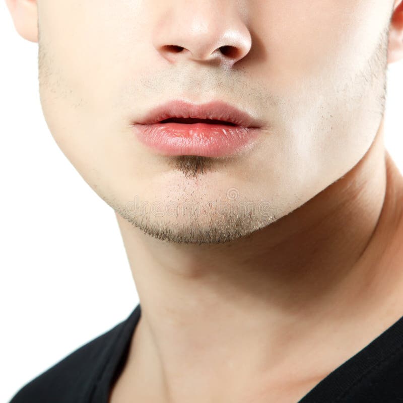 Male lips, chin and cheekbone coseup, face detail of young man. Over white royalty free stock image