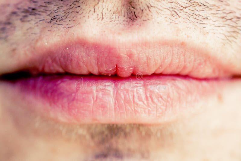 Male lips. Natural pink male lips macro stock photography