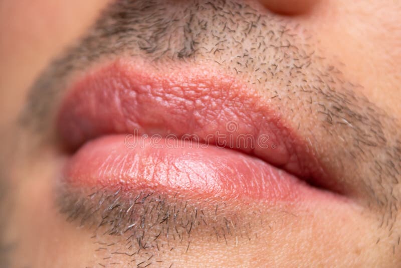 Male NU Lips. Young man closeup lips, male permanent make up, men`s bristle. Esthetician therapy and permanent makeup for men.Male NU Lips.Young man closeup stock photos