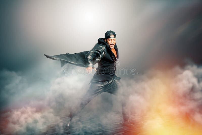 Male rock singer with cape in mysterious scenery with smoke stock photography