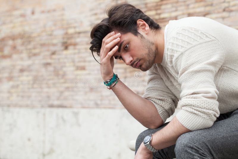 Problems and stress, stressed beautiful young man stock photography