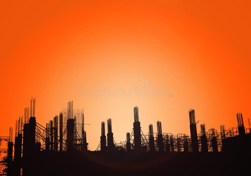 Silhouette of construction on industry site at concept sunrise time with sun light effect background with copy space add text.  royalty free stock photos