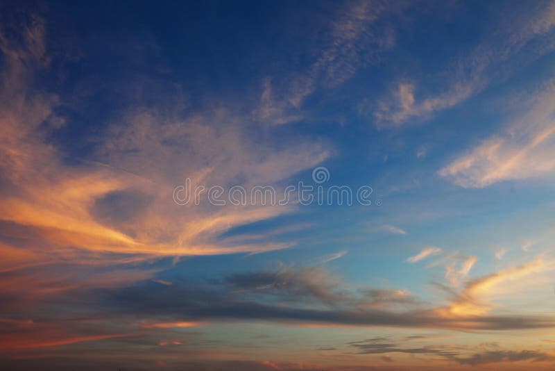 Sky and the clouds shined with sunset sun stock photo