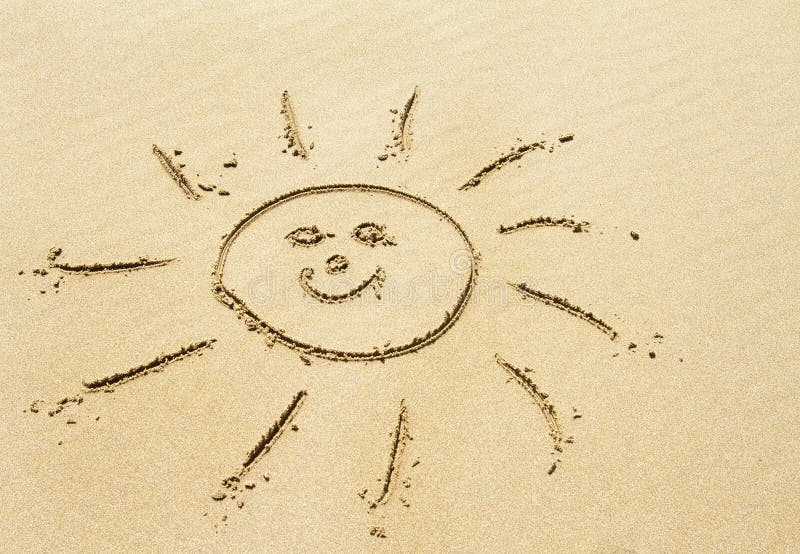Sun drawing on sandy beach stock photography