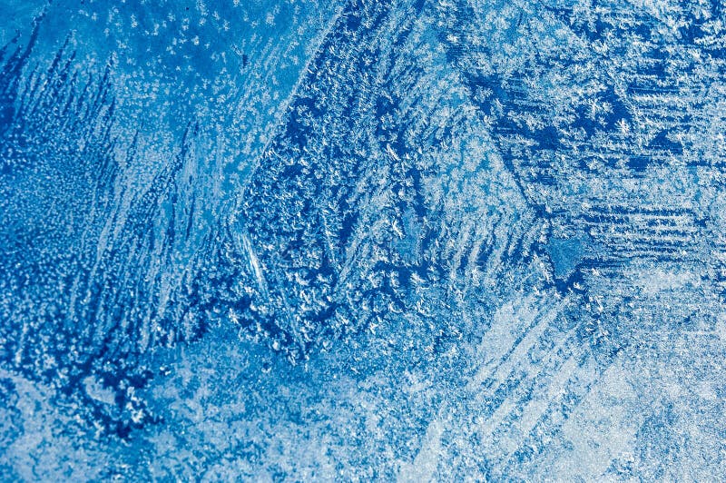 Texture, pattern. Winter photography. Picture of frost on the glass. Frozen water on the glass. a fantastic drawing, you will be. Right to use it in your design royalty free stock image