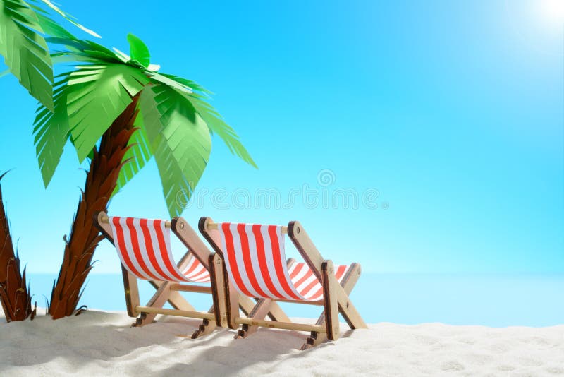 Two sun loungers under a palm tree on the sandy coast. Sky with copy space. F stock photo