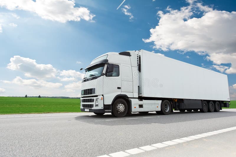 White lorry with trailer over blue sky royalty free stock photo White lorry with trailer over blue sky royalty free stock photo