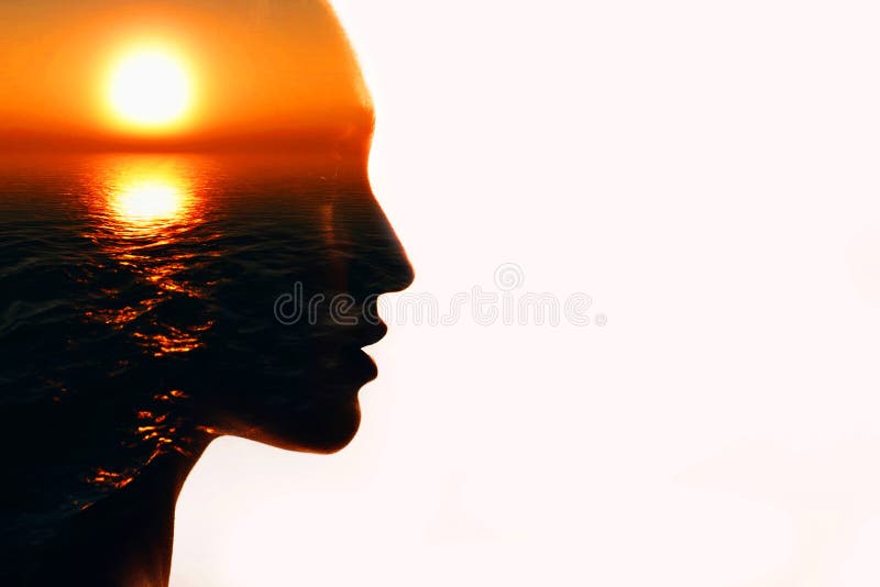 Woman head silhouette with sun inside with copy space. Multiple exposure image. Woman head silhouette with sun inside with copy space. Multiple exposure image royalty free stock photo