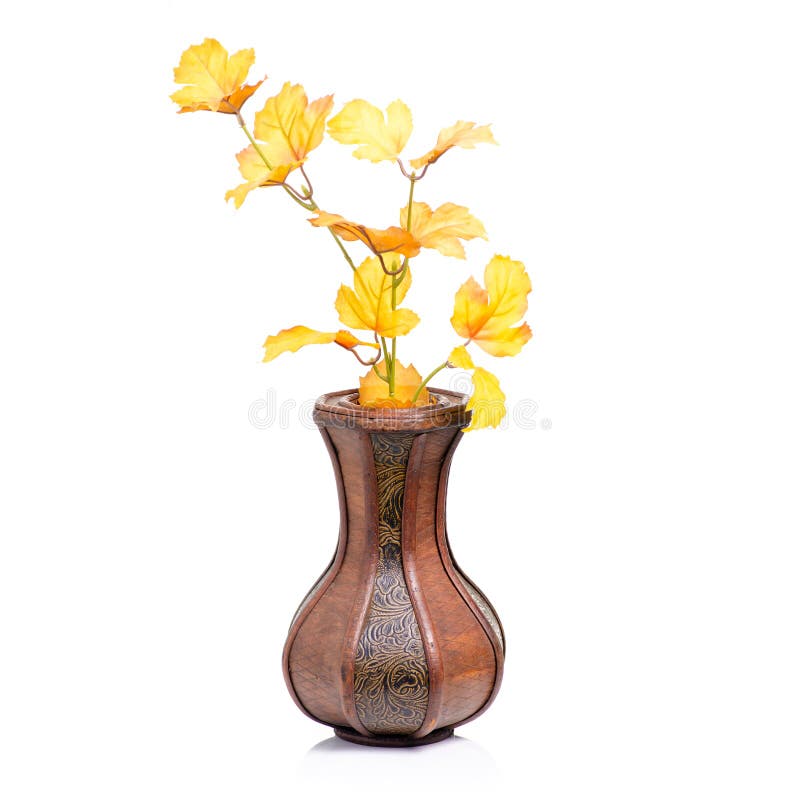 Wooden vase autumn leaves stock image