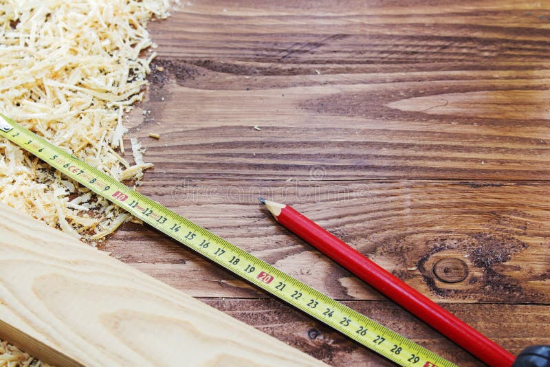 Working tool carpenter ruler, chisel, pencil, sawdust and shavings. royalty free stock photos