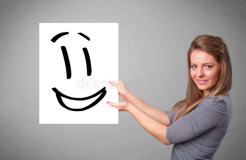 Young woman holding smiley face drawing. Attractive young woman holding smiley face drawing royalty free illustration