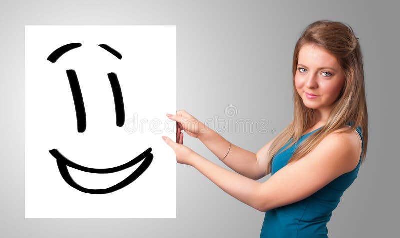 Young woman holding smiley face drawing. Attractive young woman holding smiley face drawing royalty free illustration