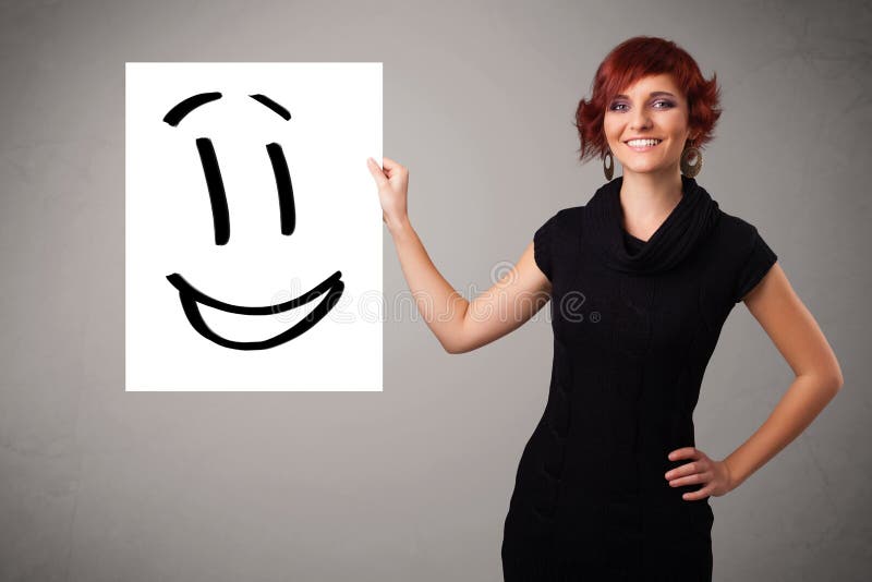 Young woman holding smiley face drawing. Attractive young woman holding smiley face drawing vector illustration