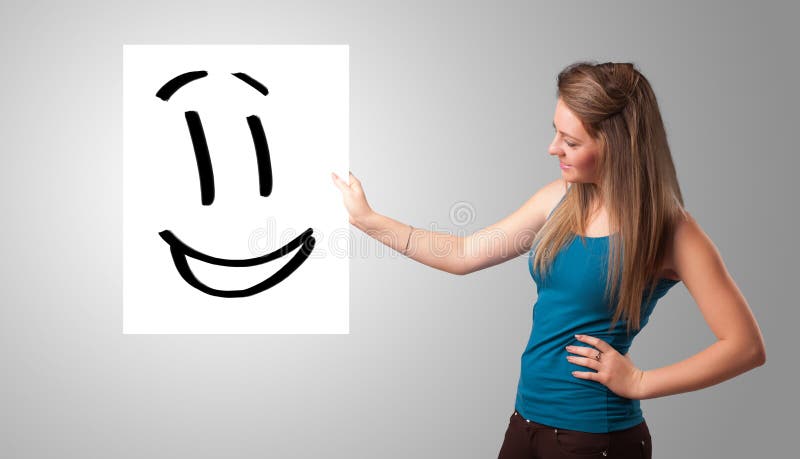 Young woman holding smiley face drawing. Attractive young woman holding smiley face drawing vector illustration