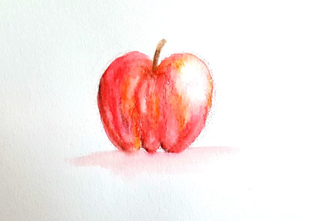 apple painted with watercolor pencils