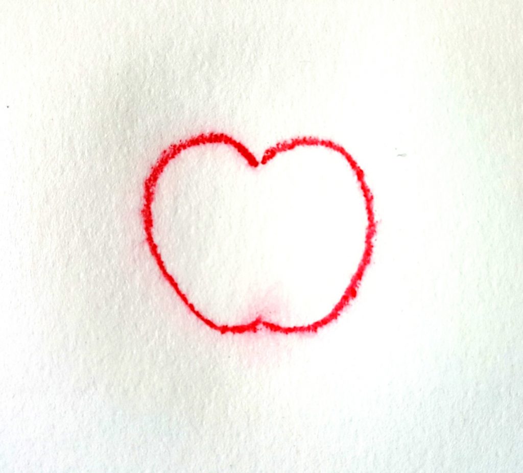 apple drawn with wet pencil on wet paper